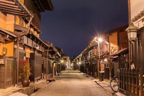 Old district wooden houses at historical Takayama town in night at gifu japan.